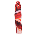 Women’s halter maxi dress in red and orange abstract print with tie neck