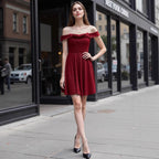 Red pleated off-shoulder evening dress with fitted bodice and flared skirt