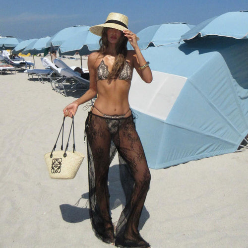 Backless halter one-piece swimwear with sheer black lace and thong-style bottoms