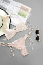 Lace-trim bikini swimwear set, light pink triangle top and tie-side bottoms flat lay
