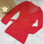 Red ruched long-sleeve swim blouse with draped wrap design