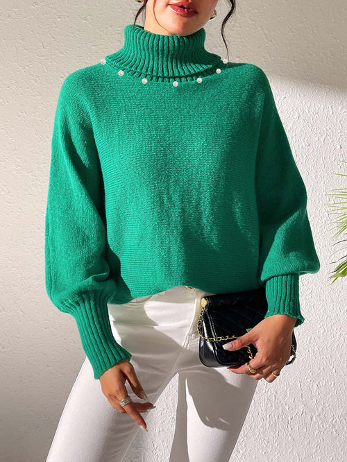 Women’s dark turtleneck sweater with pearl bead trim on the neckline