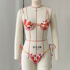 Floral one-piece swimsuit with tie straps, underwire cups, and gold-tone trim