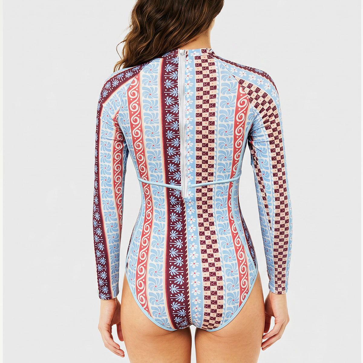 One-piece swimwear back view, long sleeves, light blue multi print with red and maroon blocks