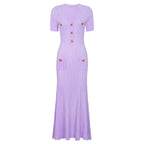 Purple maxi short sleeve dress with ribbed texture, decorative button accents and patch pockets