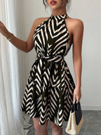 Striped halter dress, black and white zigzag pattern with cinched waist and flared skirt