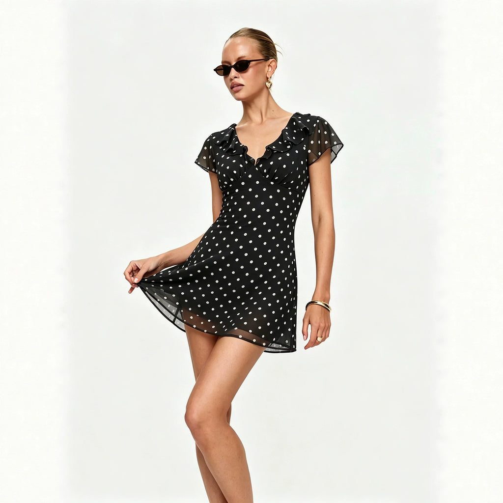 Black polka dot mini dress with ruffle V neckline and flowy short sleeves