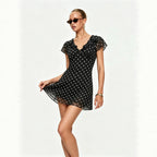 Black polka dot mini dress with ruffle V neckline and flowy short sleeves