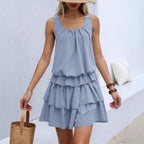 Light blue ruffled sleeveless dress with tiered skirt and gathered round neckline