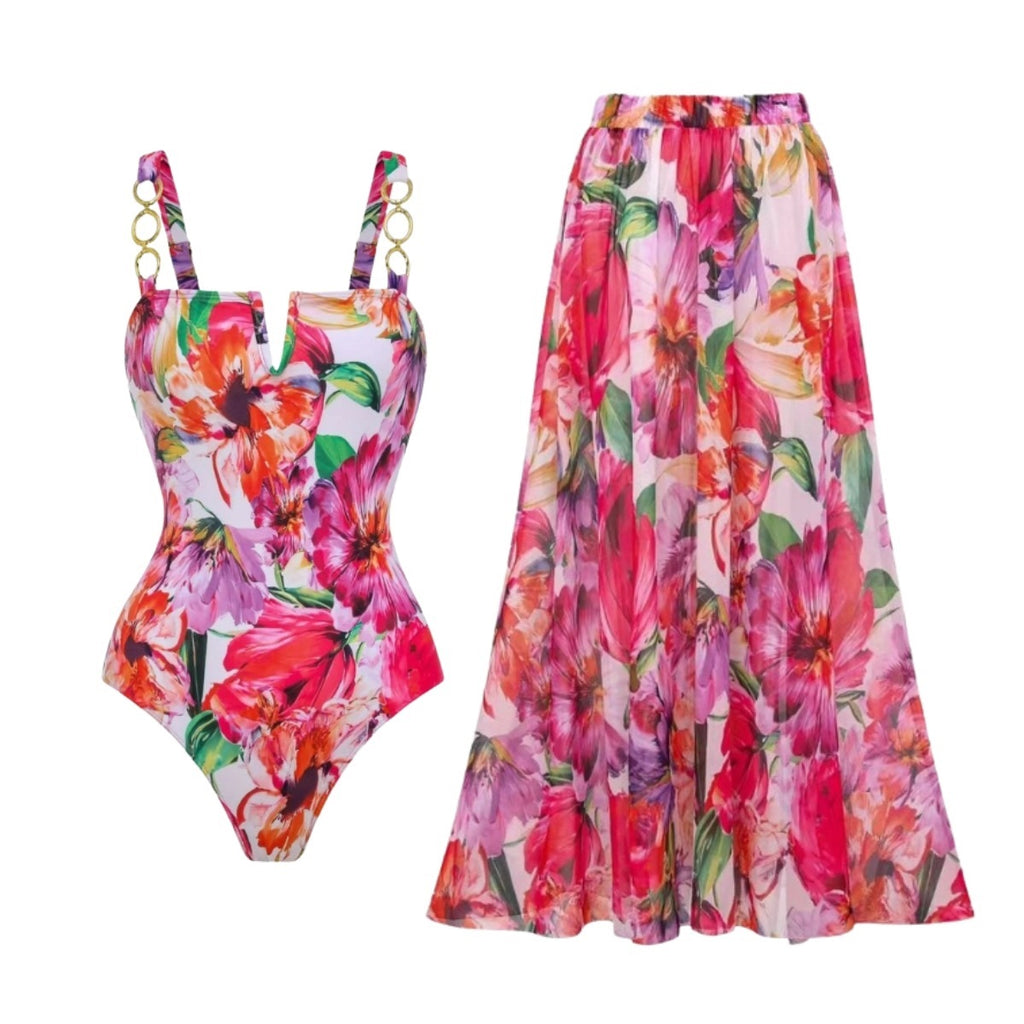 Floral one-piece swimsuit with gold ring straps, paired with long swim skirt