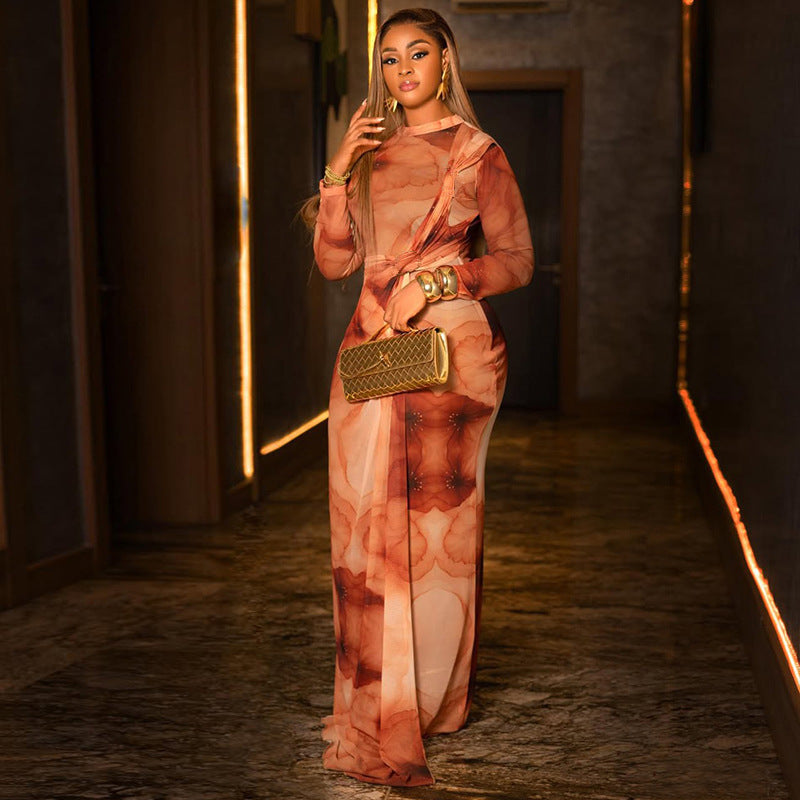 Long sleeve winter dress in orange and cream abstract floral print, draped high neck