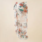 Floral leaf beach cover-up dress with ruffled edges and tie waist, white base