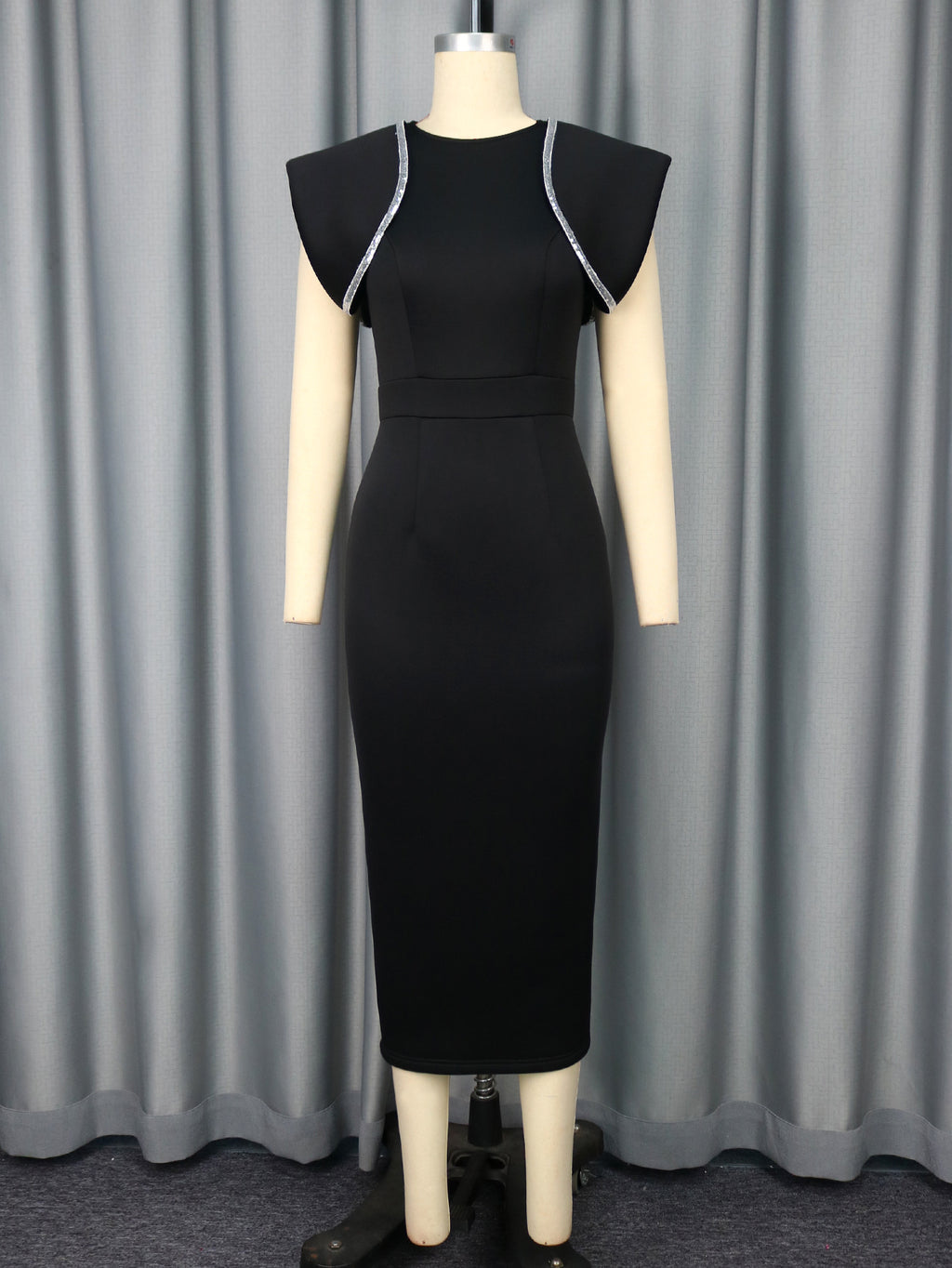 Black midi sheath cocktail dress on mannequin with short sleeves and trim piping