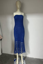 Blue strapless crochet maxi dress on mannequin with repeating circle cutout pattern