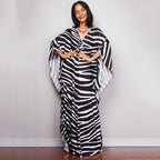 One-piece beach dress with black-and-white zebra stripes and loose kaftan sleeves