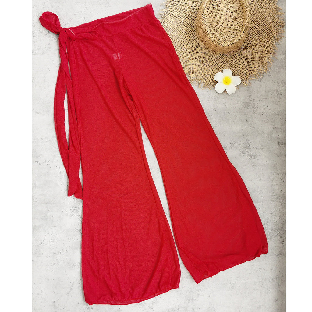 Red wide-leg beach pants with tie detail at the waist
