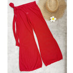 Red wide-leg beach pants with tie detail at the waist