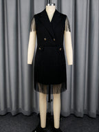 Black V-neck sleeveless dress with gold buttons and tassel fringe skirt