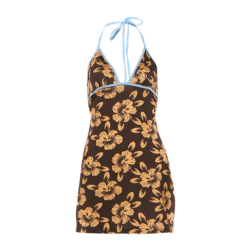 Black halter mini dress with yellow floral print, open back, and blue tie straps