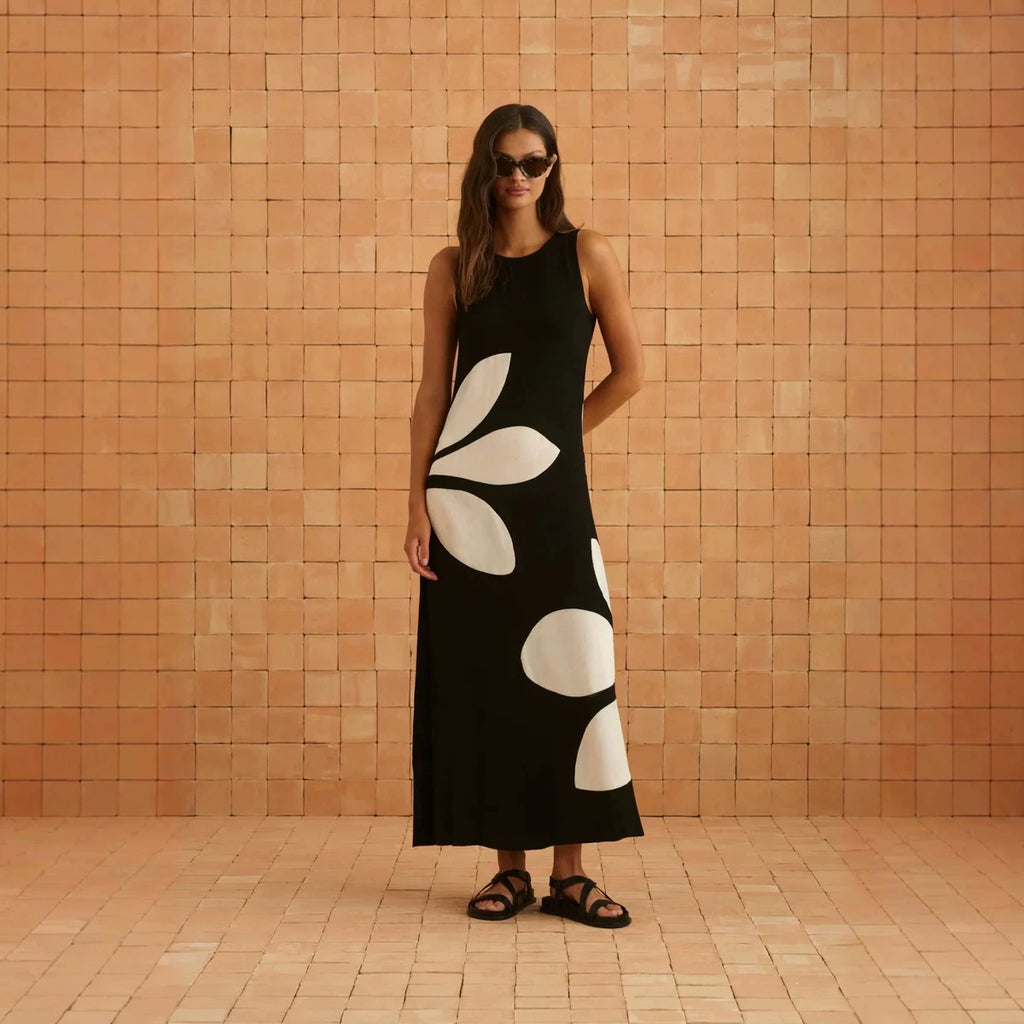 Sleeveless black maxi dress with large white abstract shapes