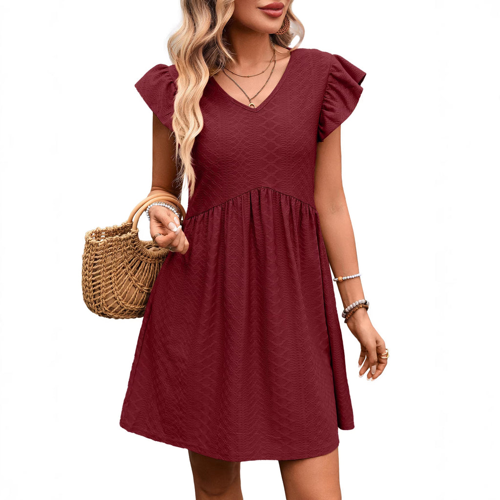 Burgundy short sleeve V-neck babydoll dress with textured fabric and gathered hem