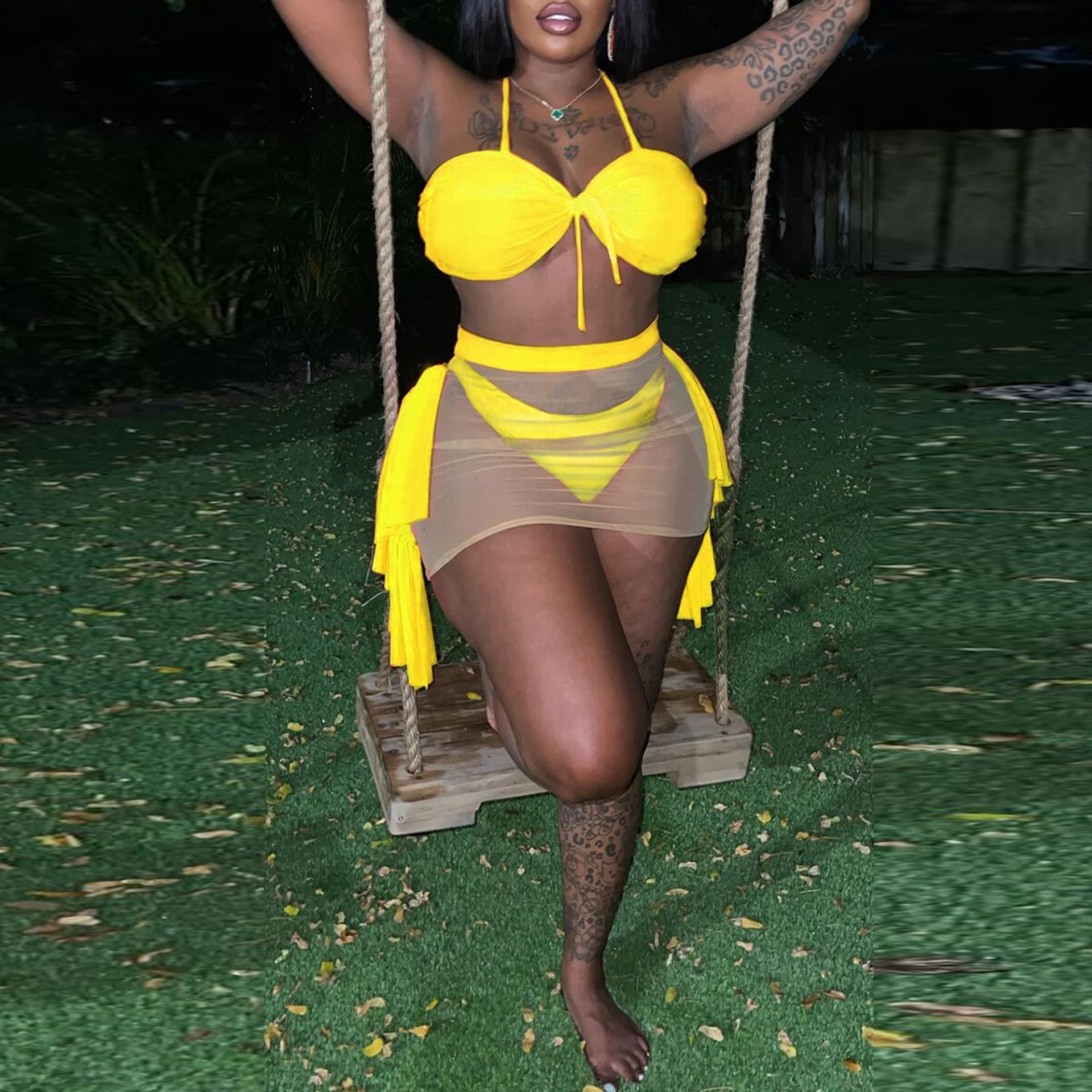 Yellow one-piece swimsuit with underwire bandeau top and sheer draped skirt