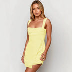 Yellow slip dress with square neckline and spaghetti straps, ruched bodice