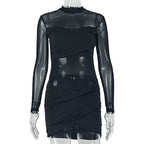 Black wrap pleated dress on mannequin, mock neck, sheer sleeves, layered ruched wrap