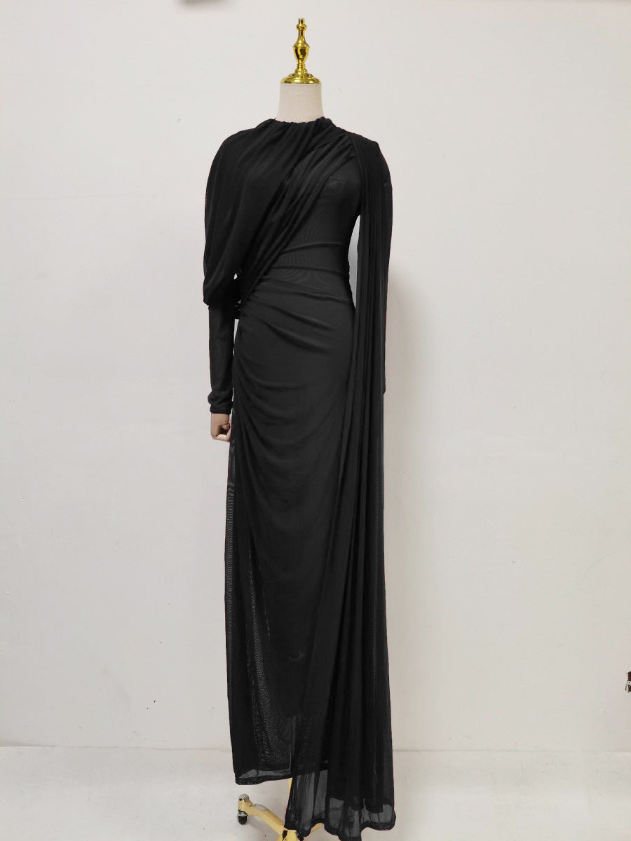 Black pleated formal dress with long sleeves and draped waist wrap, floor-length skirt