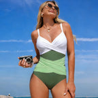 One-piece swimsuit in white and green with twisted V-neck and ruched waist
