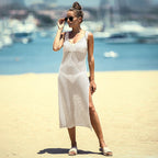 White hollow-out one-piece swimsuit with spaghetti straps, open mesh knit and mid-calf side slit
