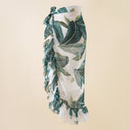 Tropical leaf print wrap beach skirt with side bow detail and tiered ruffle hem