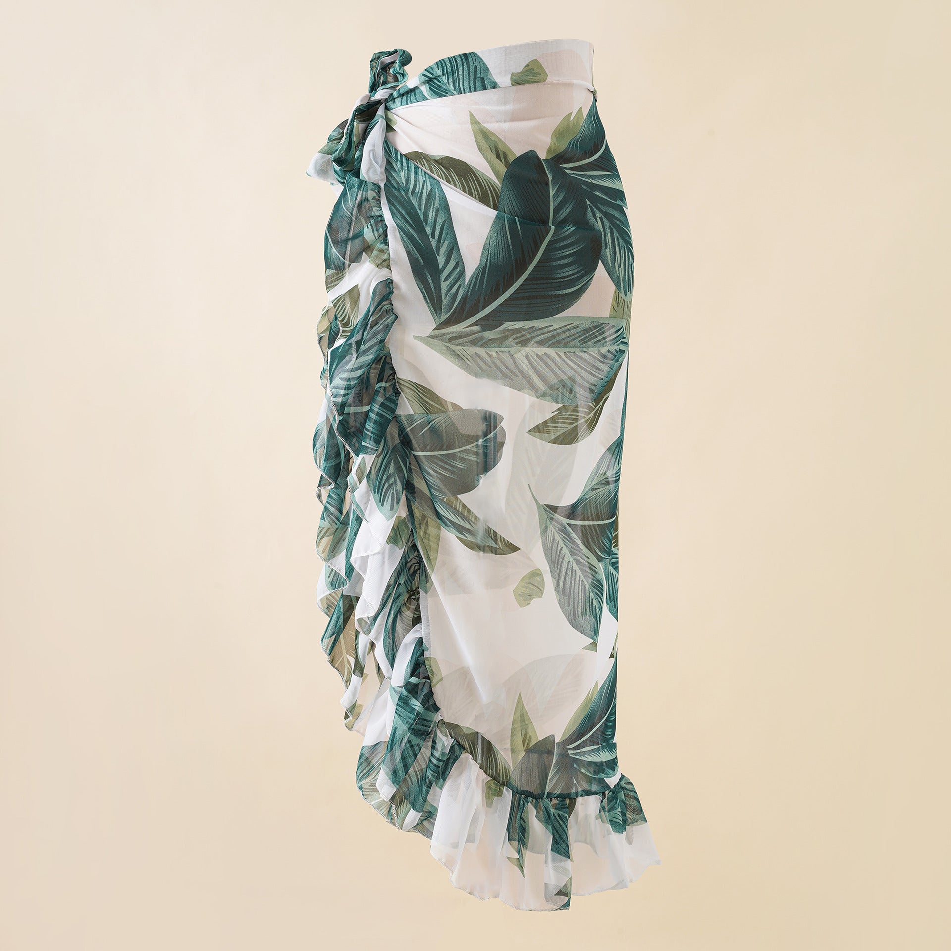 Tropical leaf print wrap beach skirt with side bow detail and tiered ruffle hem