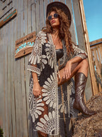 Black lace cardigan with white floral medallion pattern, open front, 3/4 sleeves