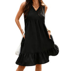 Black pleated sleeveless dress with V-neck and tiered ruffle hem