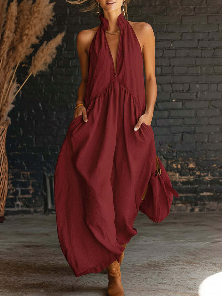 Burgundy sleeveless halter maxi dress with deep V neckline and gathered waist