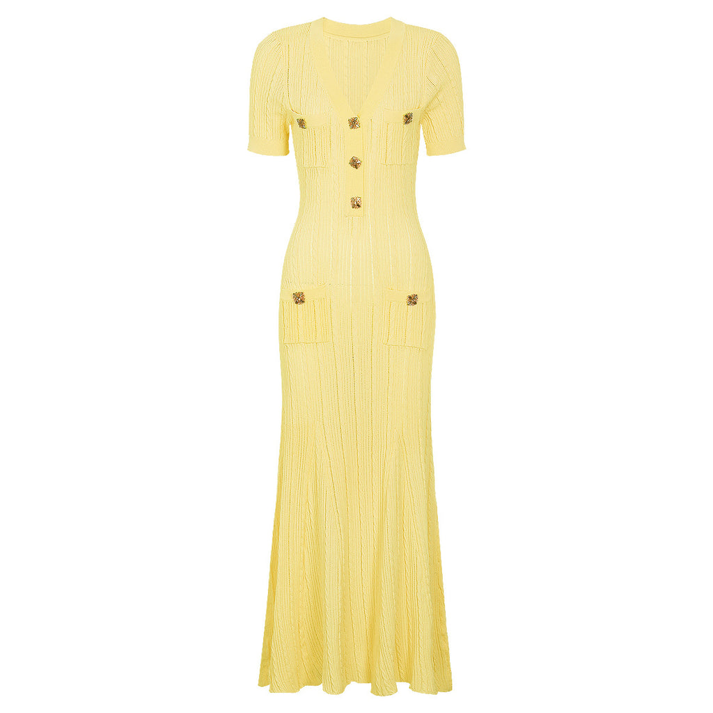 Yellow maxi short sleeve dress with ribbed texture, decorative button details and chest pockets