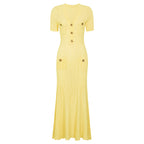 Yellow maxi short sleeve dress with ribbed texture, decorative button details and chest pockets