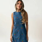 Blue denim sleeveless vest with red and green embroidery, crew neck, relaxed fit