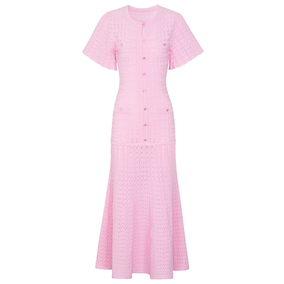 Pink maxi silk dress with short sleeves, fitted button placket, and flared textured skirt.