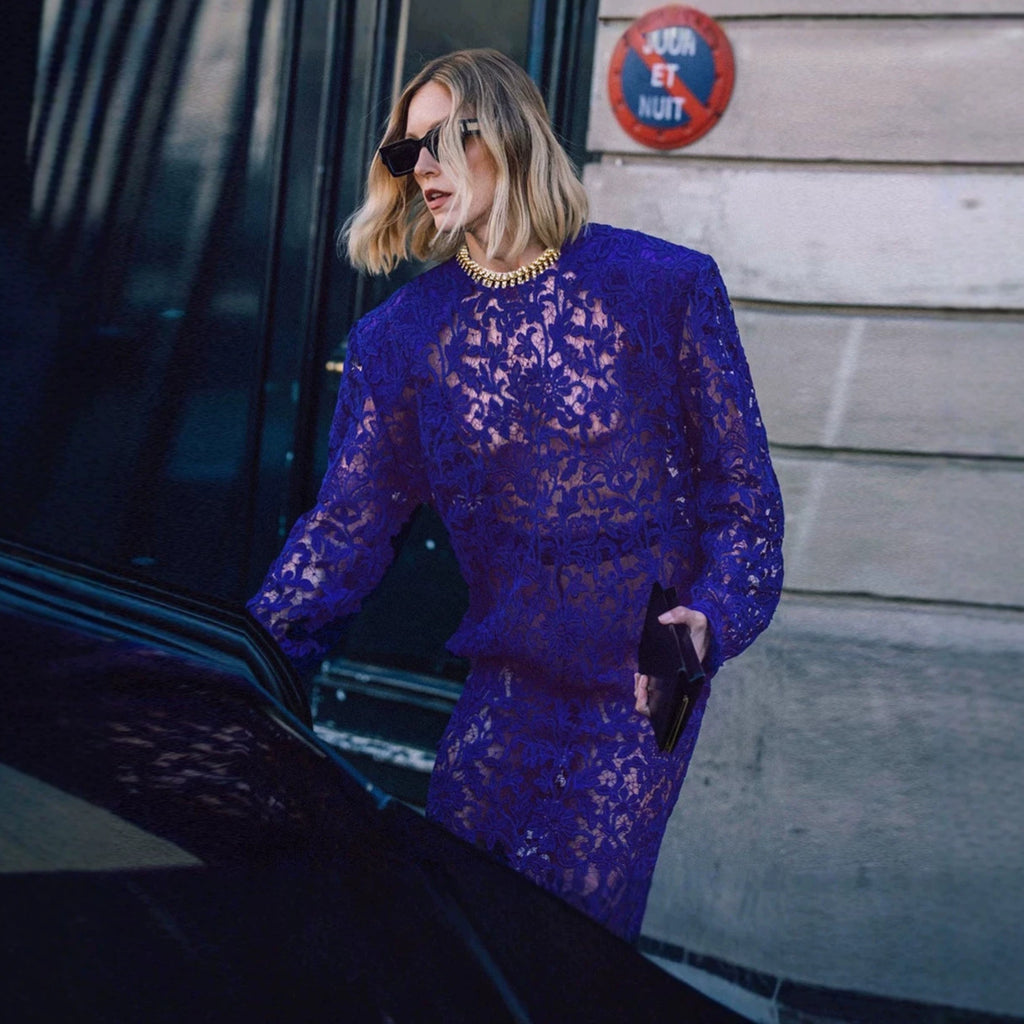 Navy lace long sleeve sheath dress with gold-trimmed collar and intricate floral lace.