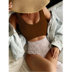 One-piece swimsuit with brown scoop top and speckled bikini briefs, seamless fit