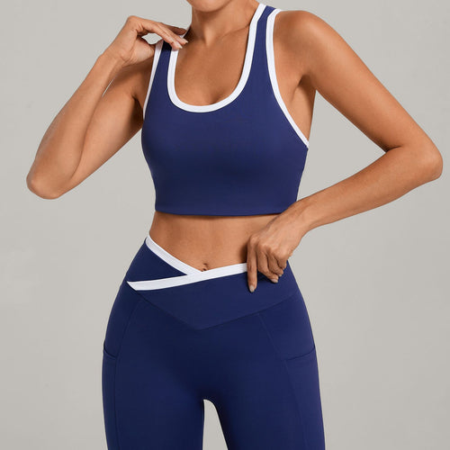 Women's sports vest, navy blue with white contrast binding and racerback U neckline
