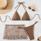 Brown halter swimwear with triangle top, leopard ruffle skirt, and matching bikini bottom