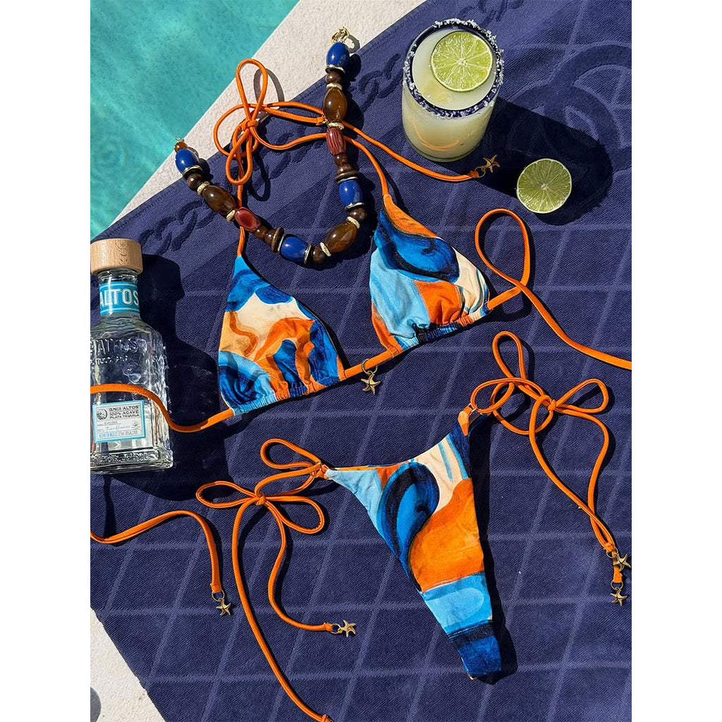 Multi-color printed one-piece swimwear with orange string ties, low-cut front