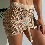 Crocheted beach shorts in khaki with open lattice mesh and side drawstring ties
