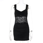 Black sleeveless mini dress with lace bodice panel and ruched skirt on mannequin.