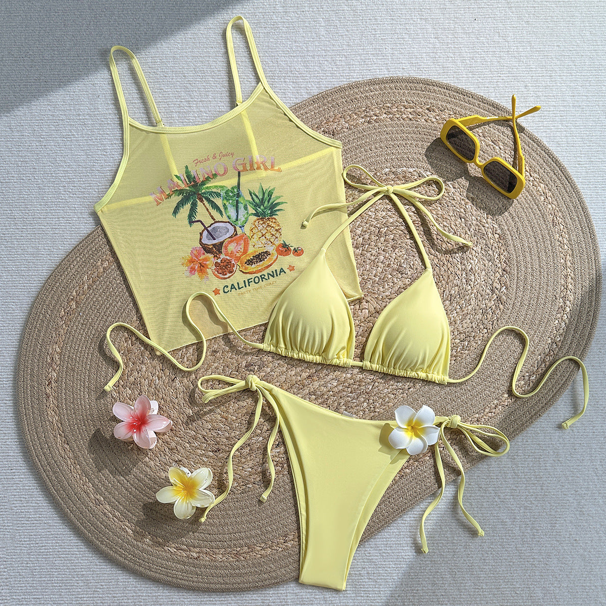 Yellow tropical one-piece swimsuit with palm fruit graphic and tie side accents