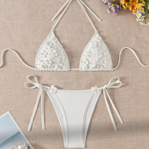 White 3D floral triangle bikini top and high-leg bikini bottoms with lace-up ties