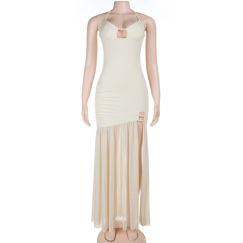 Women's cream sling spring dress on mannequin, spaghetti straps and tiered maxi hem